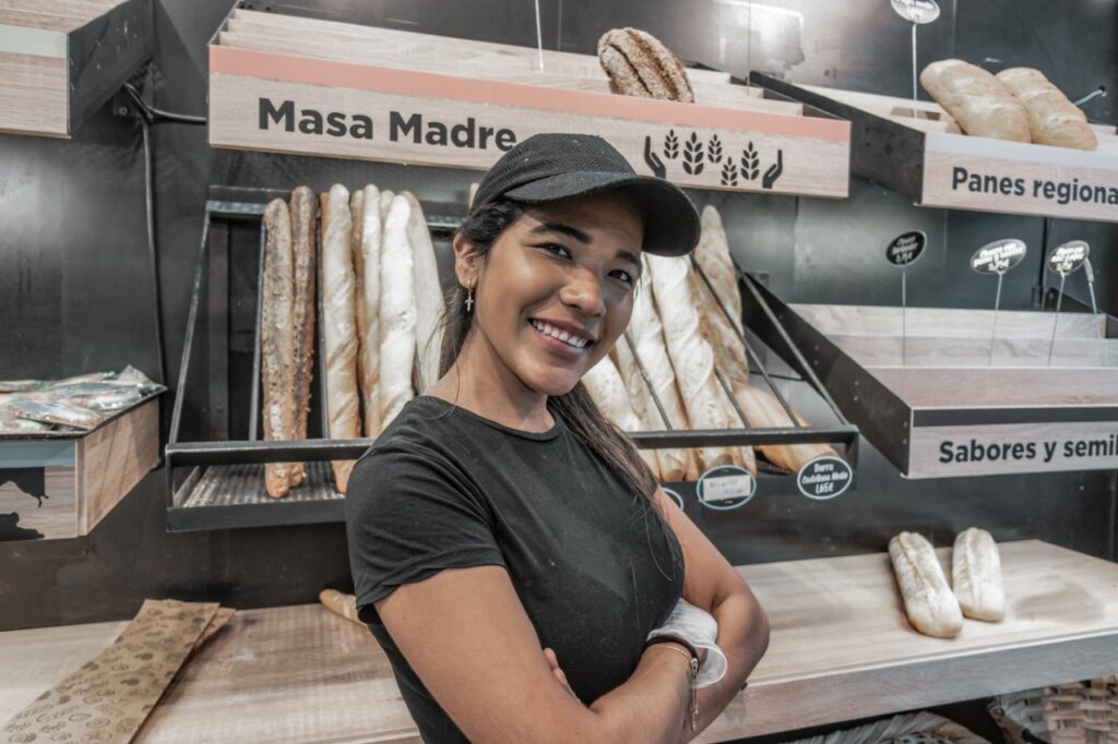 Latin Business Owner showing off her business