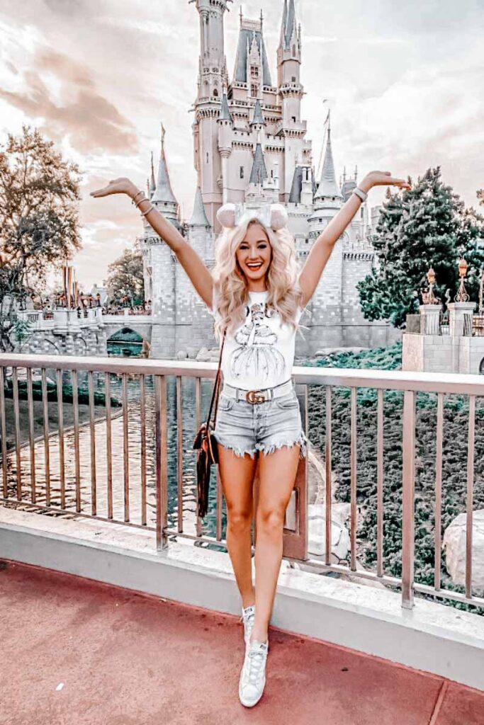 Another pretty influencer taking a photo in front of Cinderella's Castle at Disney World
